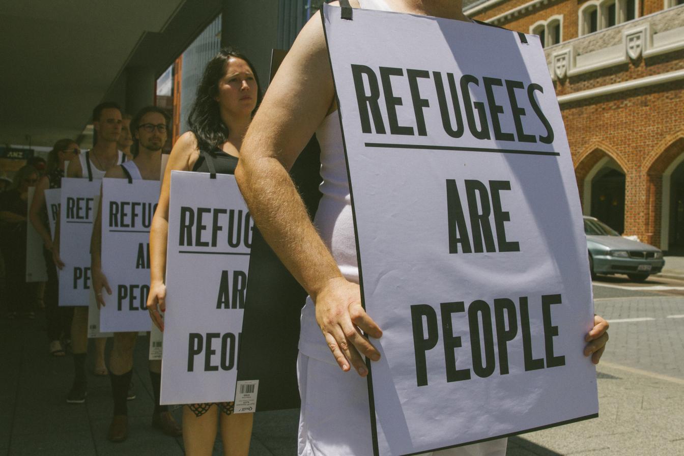 Sign reading 'Refugees are people'