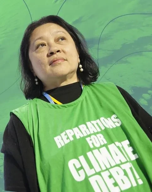 Lidy Nacpil met hesje 'Reparations for Climate Debt'